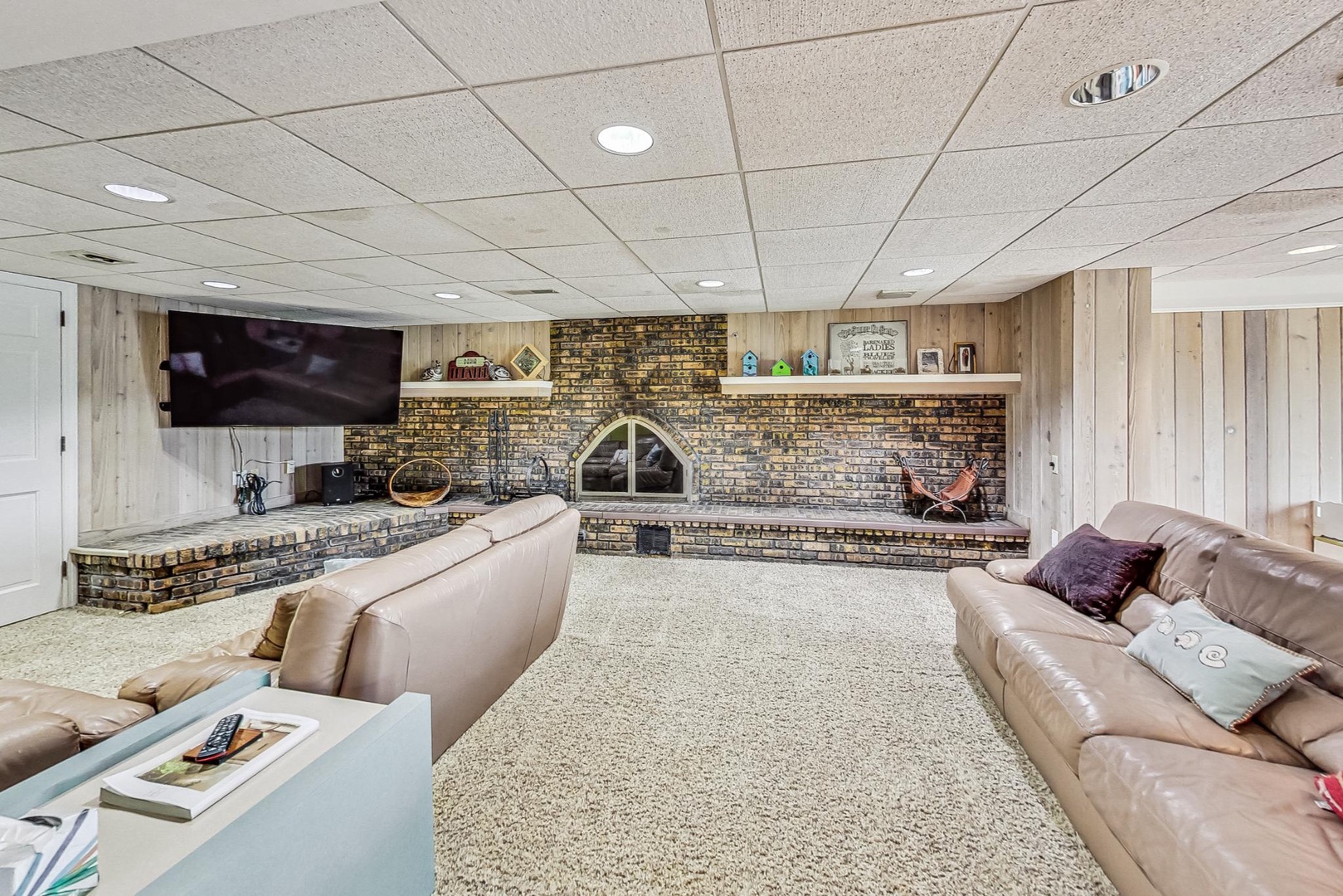 Lower Level Living Room with Decorate Fireplace