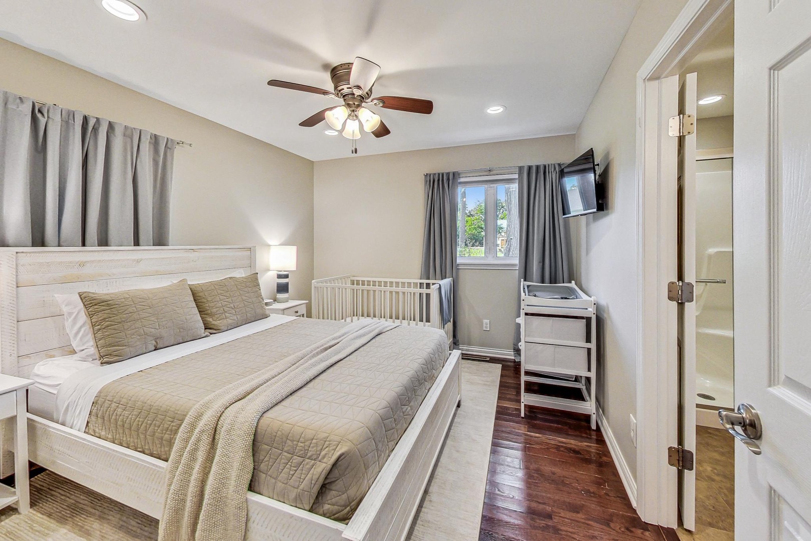 Primary Bedroom with Queen Bed and Crib