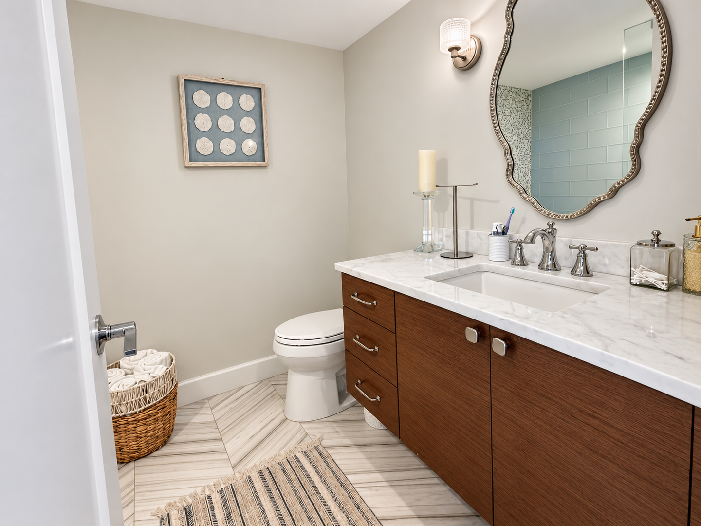 Bright, polished marble bathroom listing photo