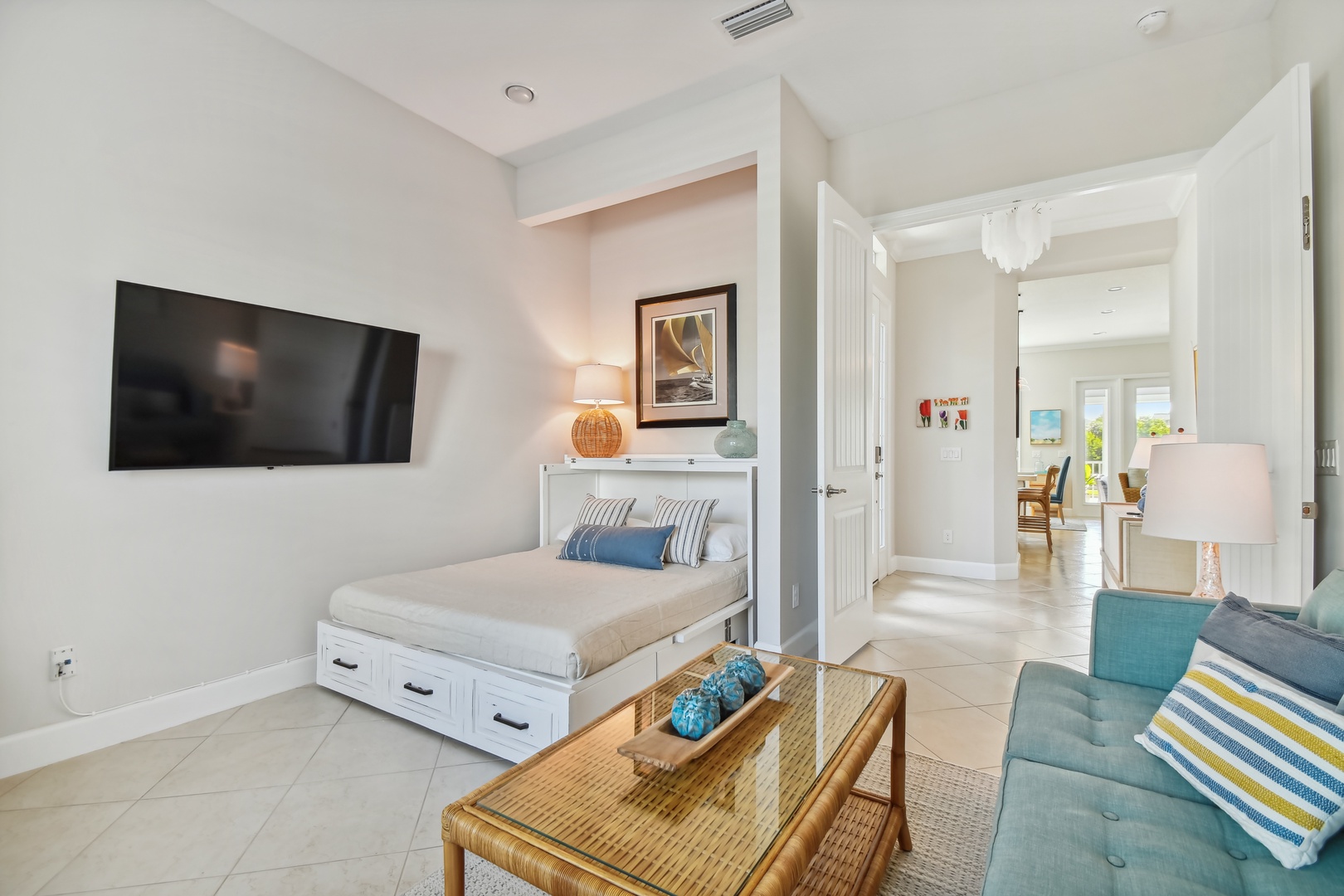 Unwind in your stylish studio with a clever Murphy bed, cozy seating area, and modern amenities—perfect for relaxing after exploring.