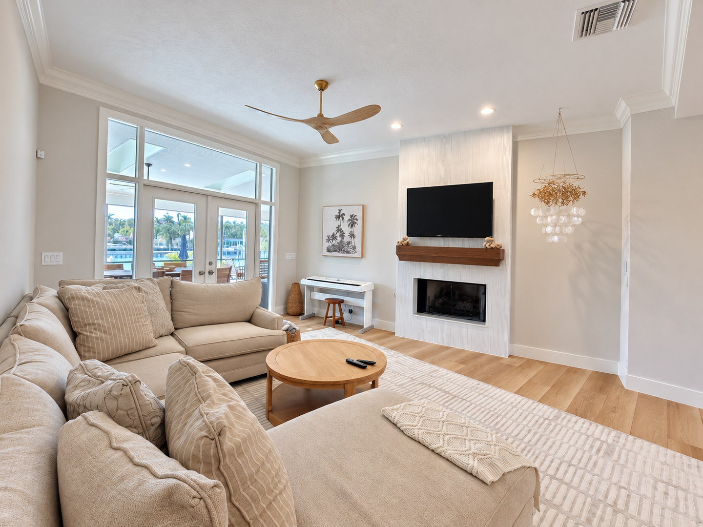 Bright living room with piano and fireplace