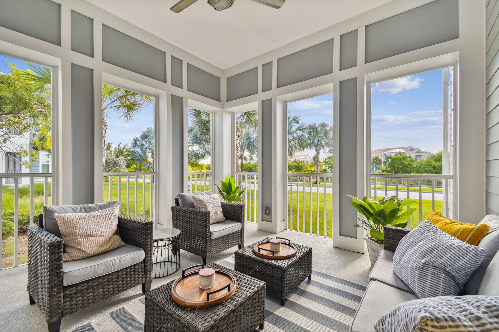 Your bright screened porch offers comfortable seating and peaceful palm tree views—perfect for morning coffee or evening relaxation.