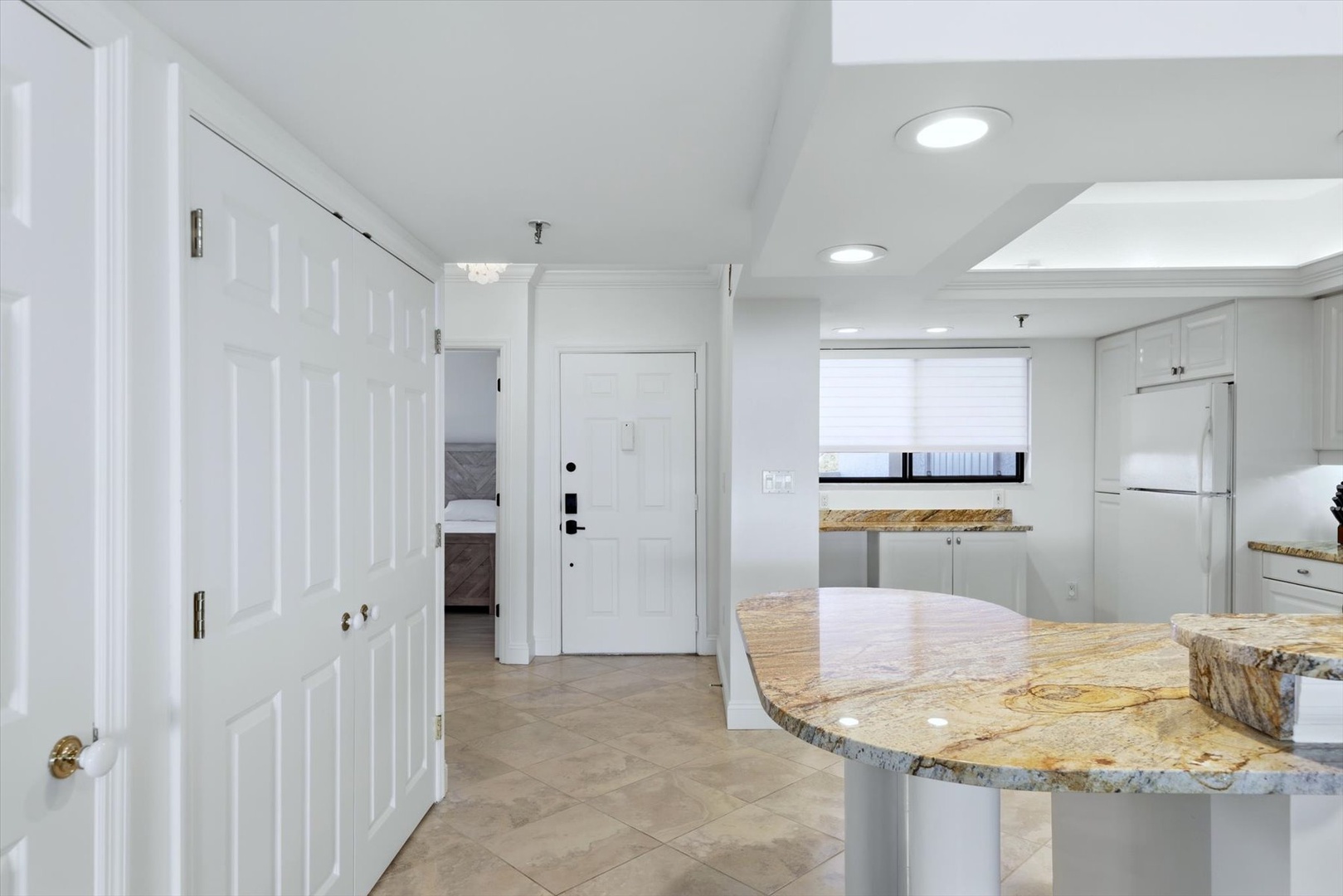 Your modern kitchen flows seamlessly with granite countertops and bright skylights flooding the space with natural light.