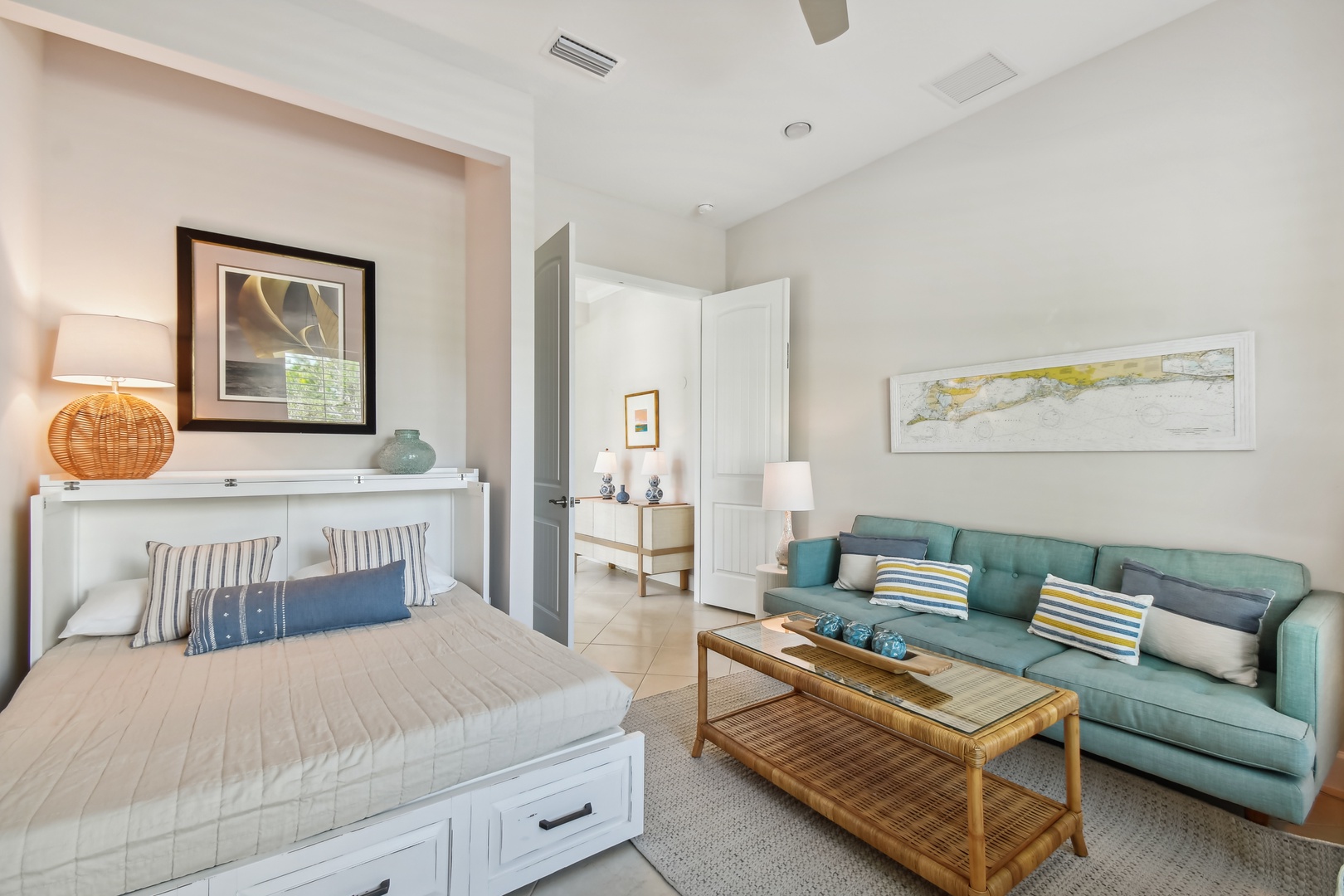 Relax in this bright, coastal-inspired studio where your murphy bed and cozy seating create the perfect blend of comfort and functionality for your getaway.