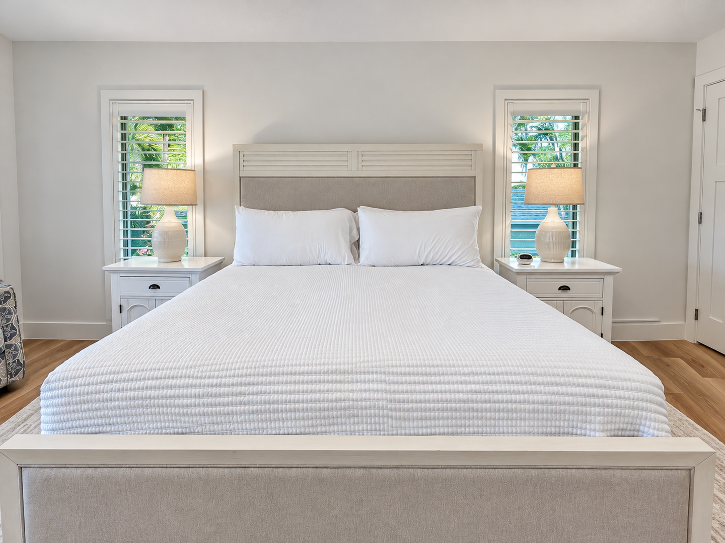 Bright bedroom retreat with fireplace and windows