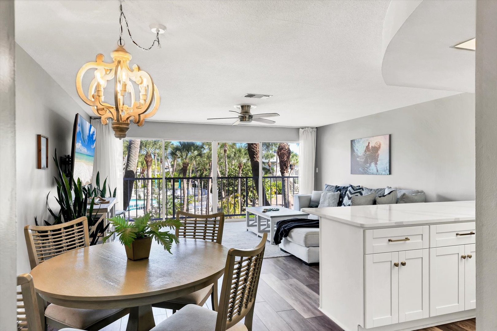 Your elegant open-plan living space flows seamlessly from dining to lounge, with tropical palm views from your private balcony creating the perfect beach getaway.