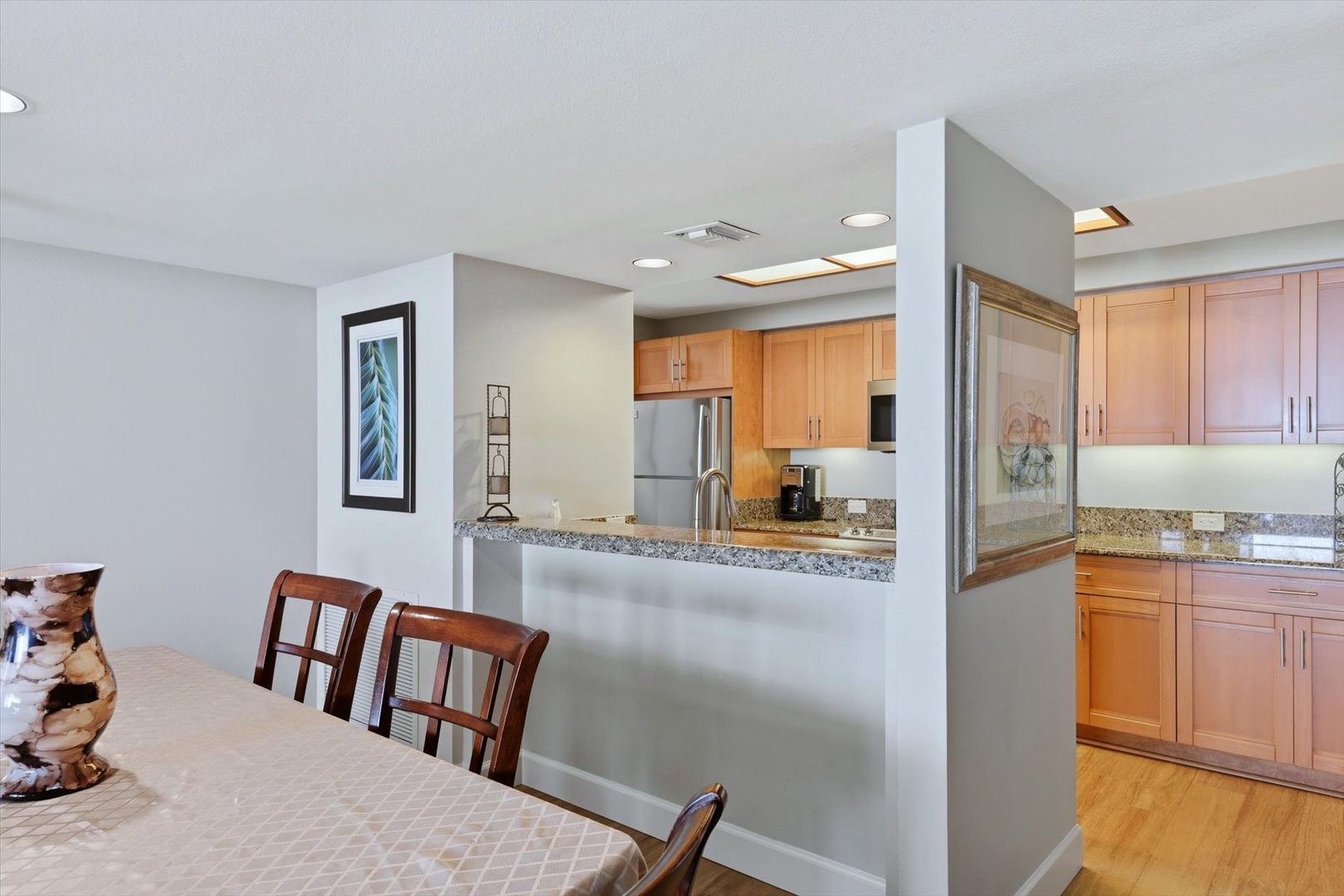 You'll love cooking in this open kitchen with granite counters and stainless steel appliances, perfect for memorable meals together.