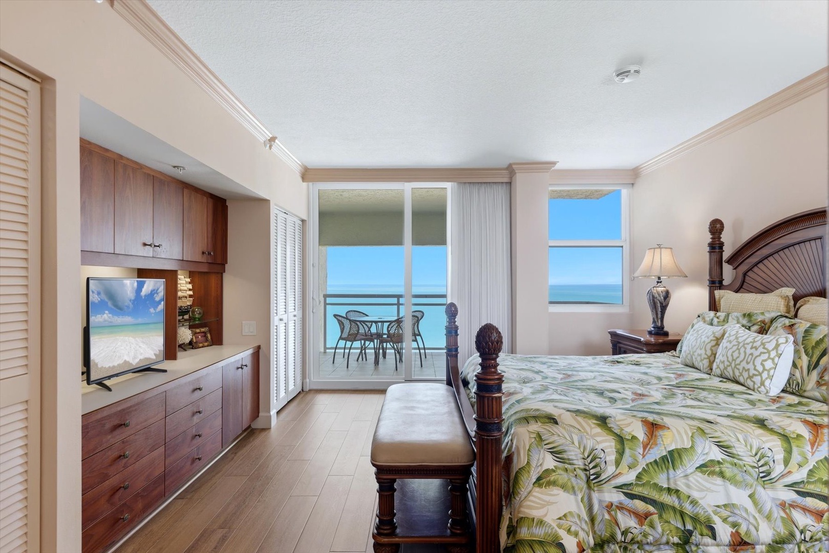 Wake up to stunning ocean views from your private balcony. This elegant bedroom offers tropical comfort with luxury furnishings and direct sea access.