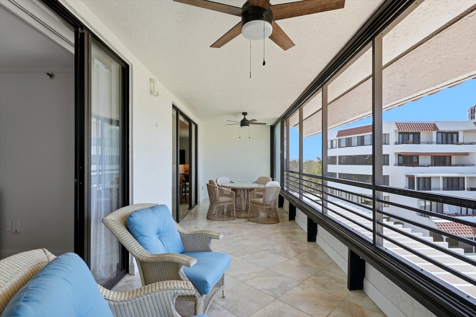 Unwind on your spacious covered terrace with comfortable seating and dining area, perfect for morning coffee or evening relaxation.