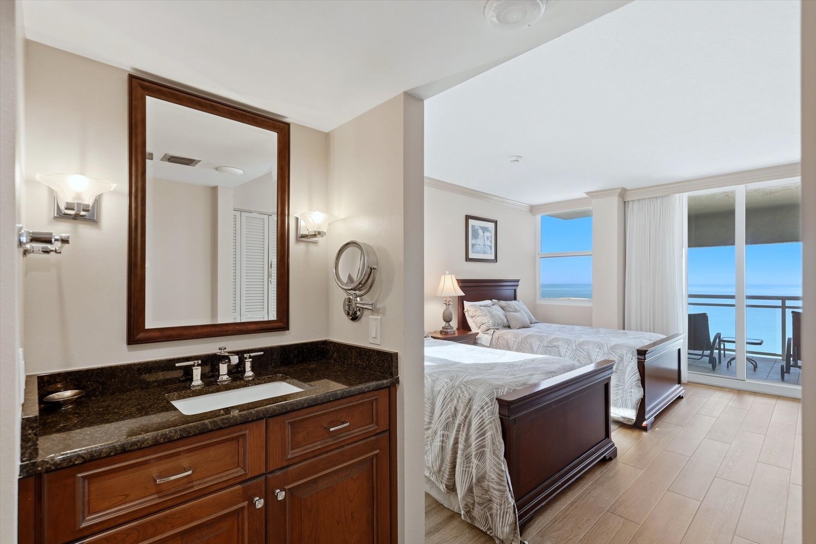 Wake up to stunning ocean views from your spacious bedroom suite, where elegant furnishings and a private en-suite create your perfect beachfront retreat.