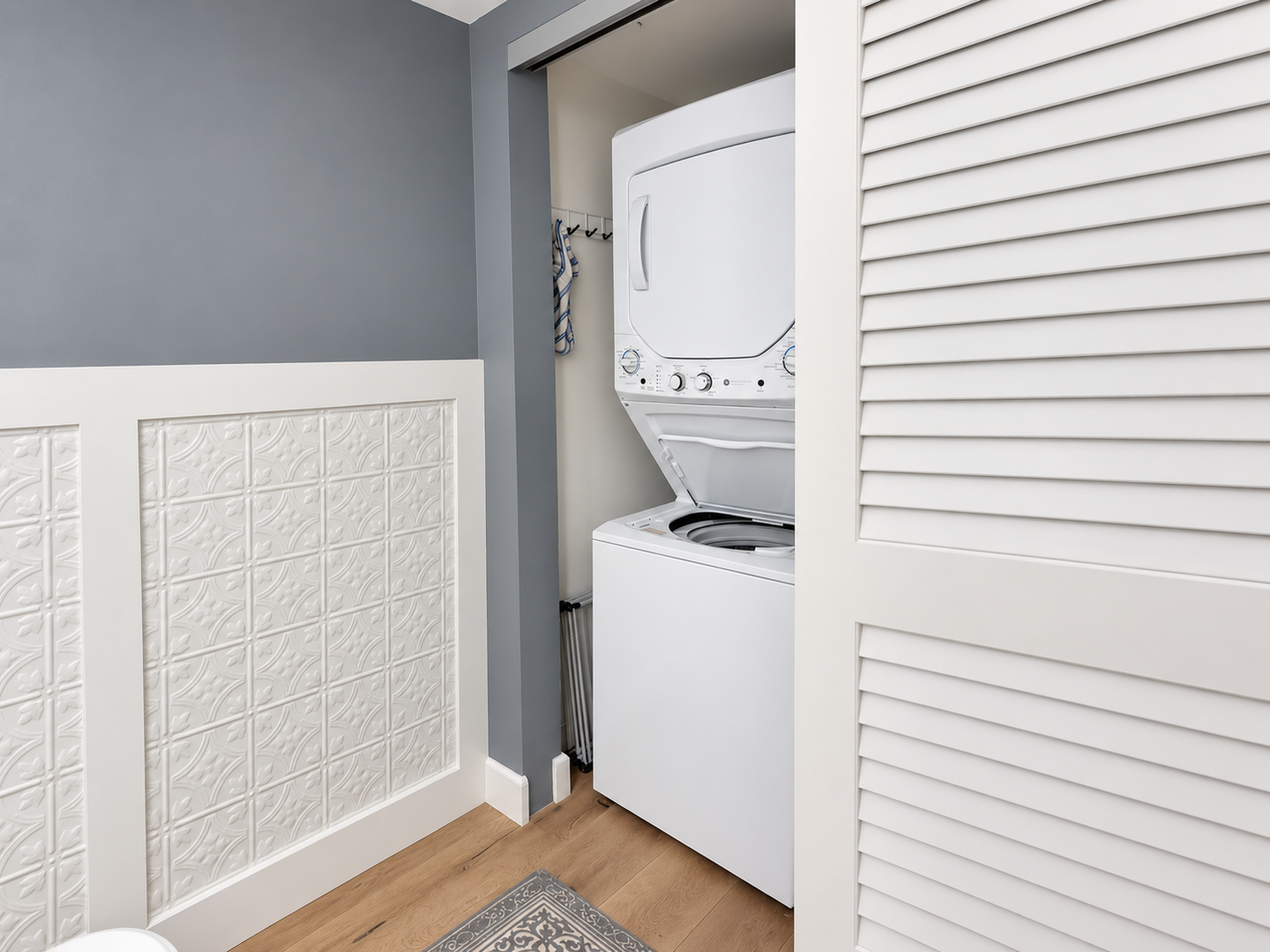 Half bathroom laundry closet with washer-dryer