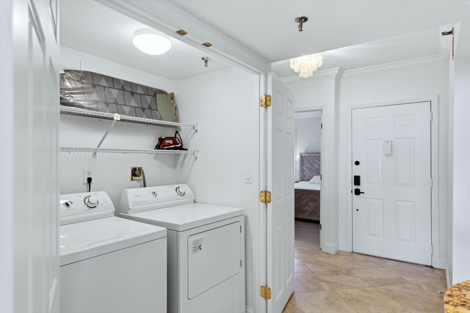 Your private laundry area features full-size washer and dryer with convenient shelving for all your vacation essentials.