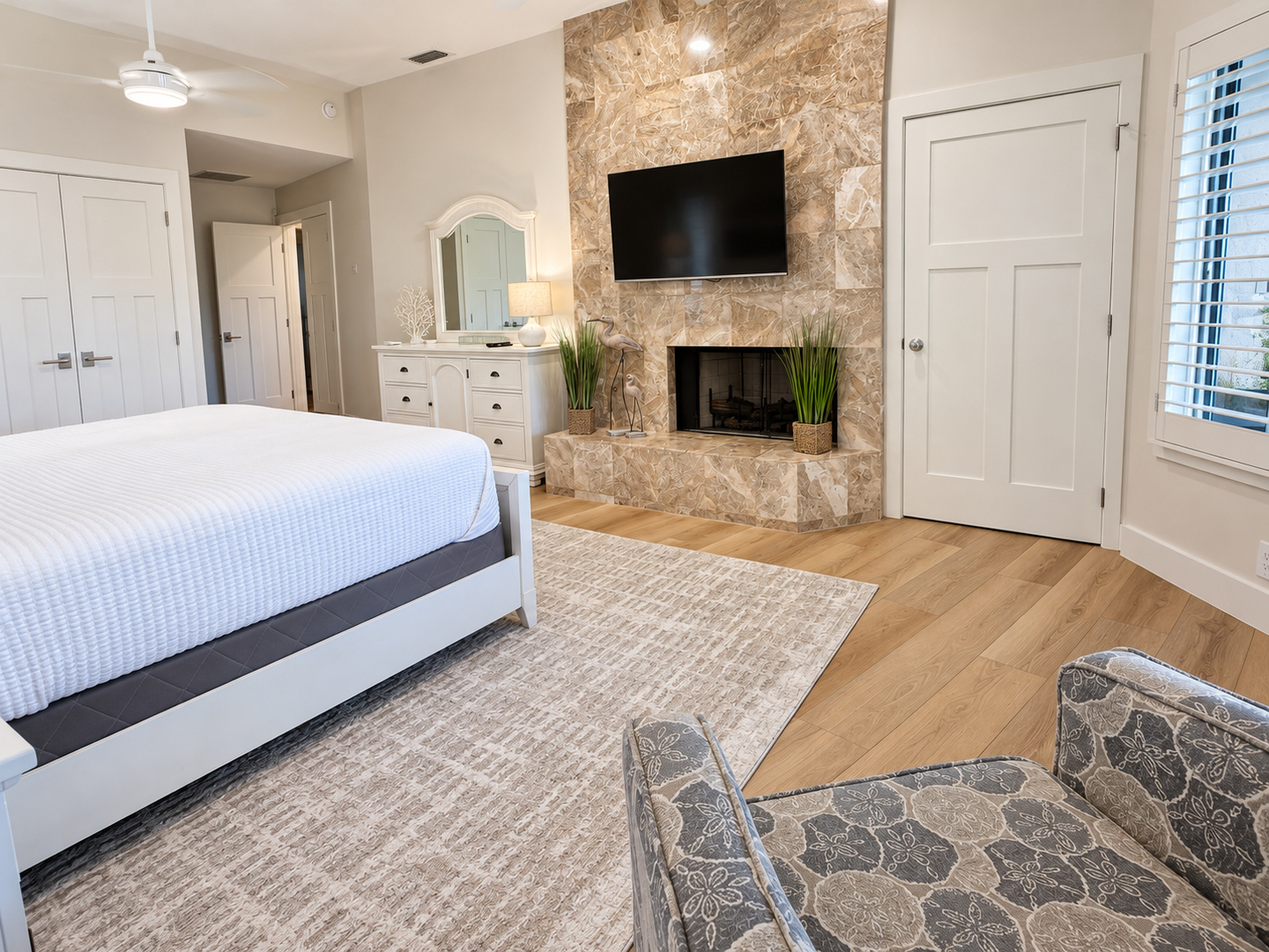 Bright bedroom with stone fireplace