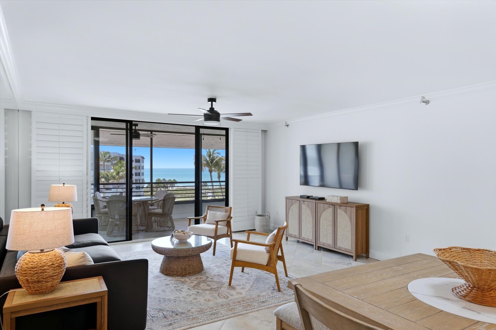 Unwind in your stylish living room with ocean glimpses through your private balcony doors. Modern comfort meets coastal charm.