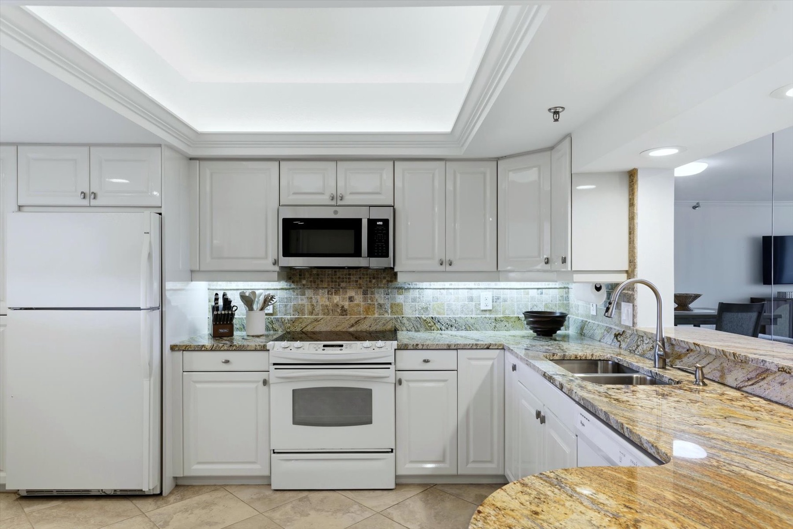 Your gourmet kitchen features granite countertops, modern appliances, and a skylight that fills the space with natural light for memorable cooking moments.