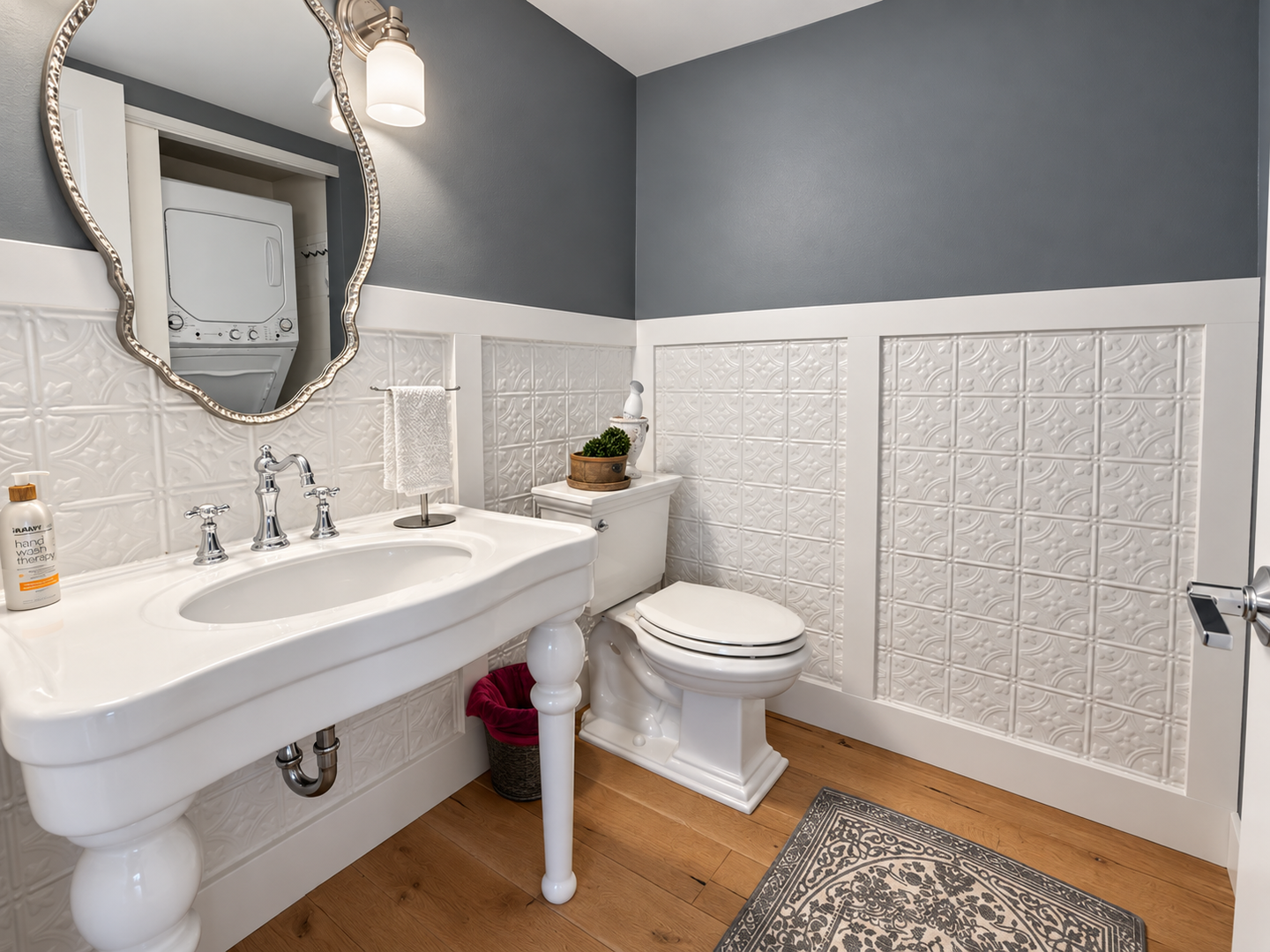 Polished bathroom with ornate mirror