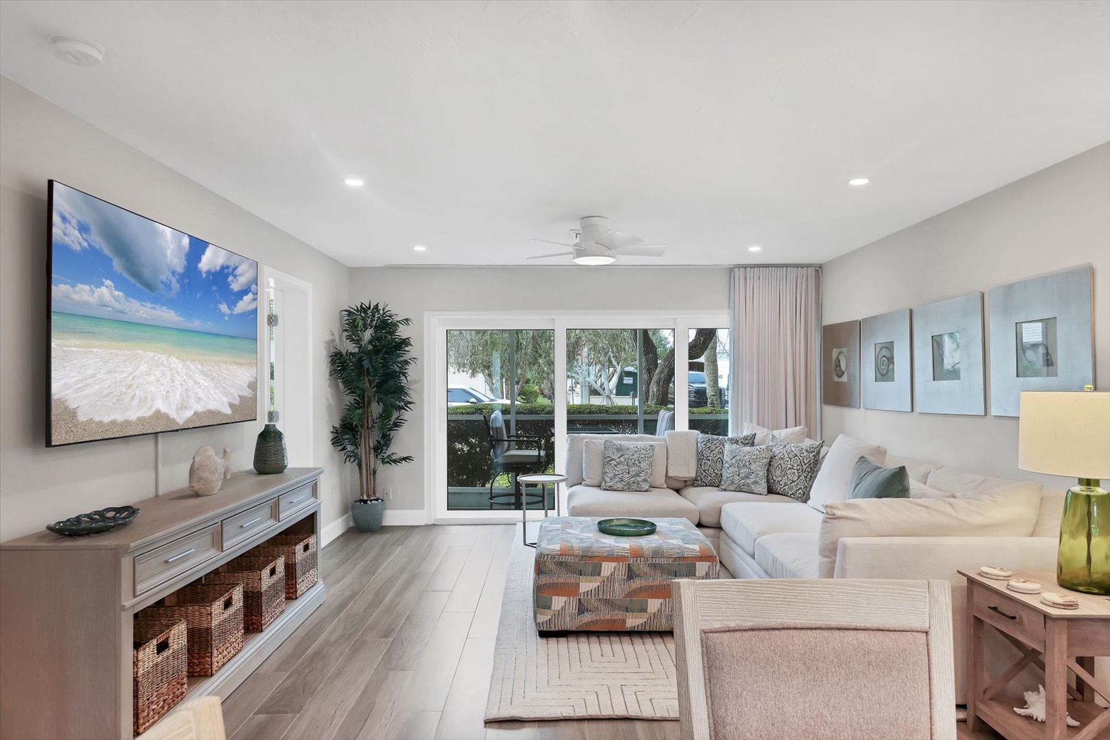 Sink into your spacious sectional sofa and enjoy entertainment on the large TV in this bright, modern living room.