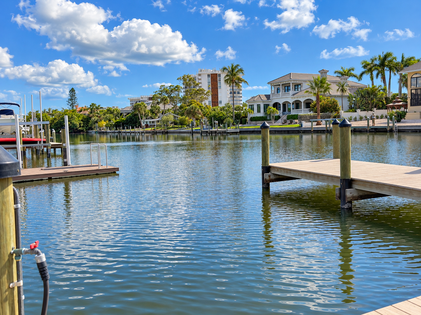 Sunlit waterfront home with dock