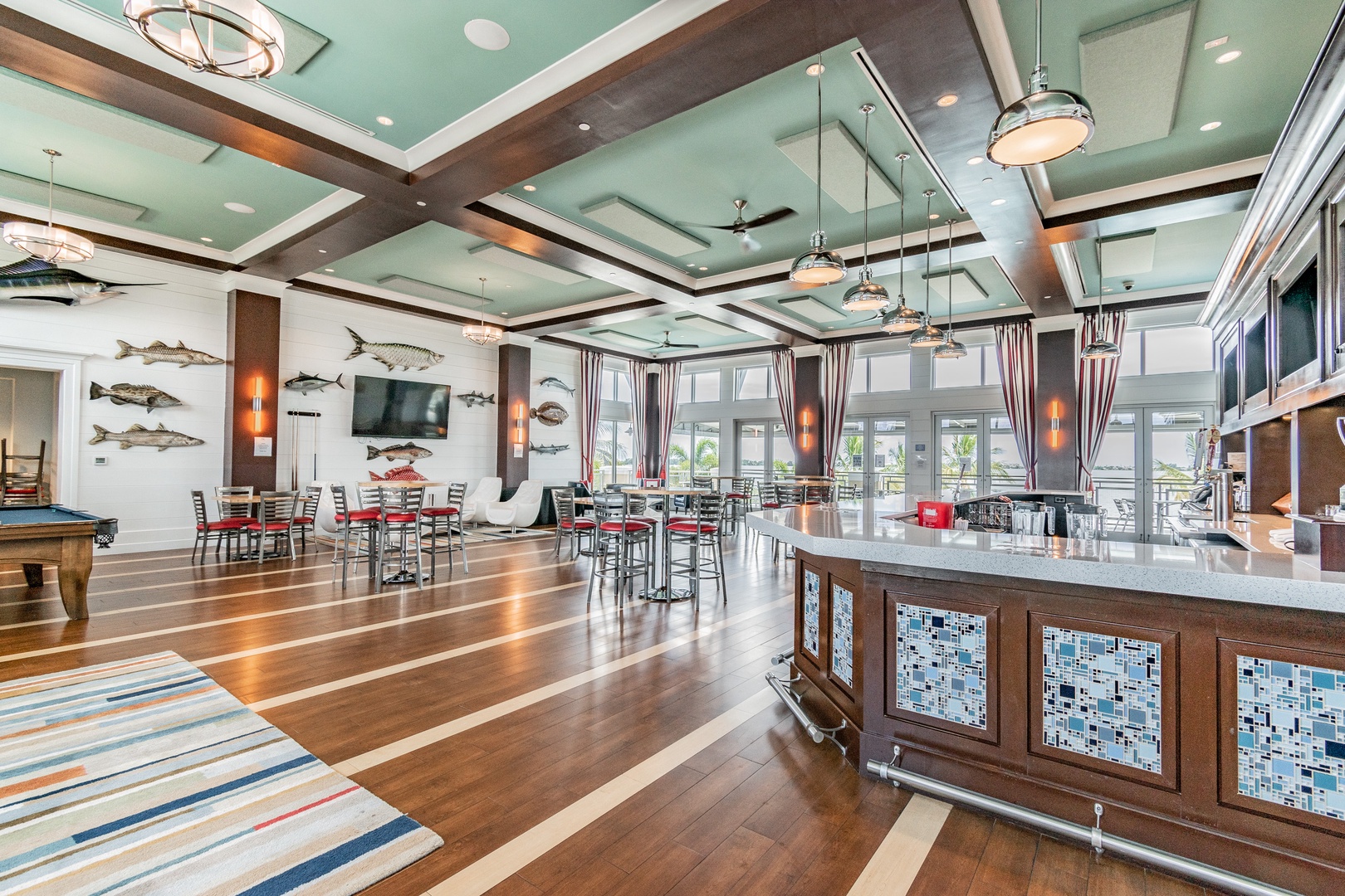 Stunning communal space with coastal décor, billiards table, and elegant dining areas where you'll create memorable moments.