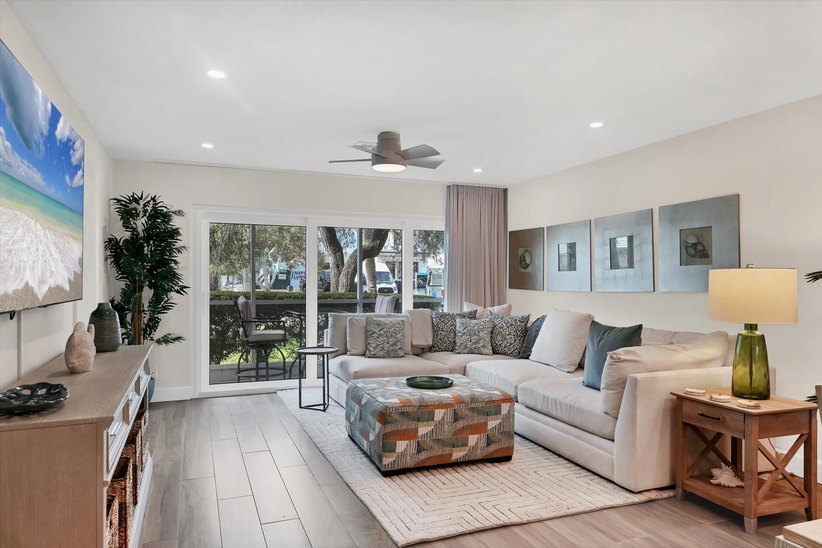 Sink into plush seating while enjoying natural light streaming through sliding glass doors to your private patio.