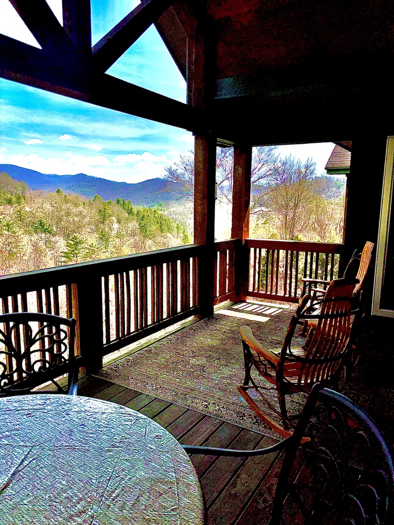 Rocking chairs and long-range mountain views — your spot for morning coffee or evening wine.