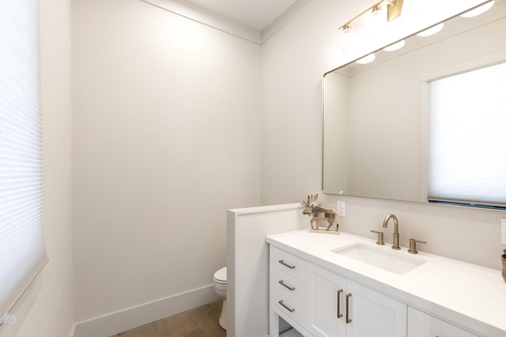 Step into this half bathroom with clean lines and modern fixtures. Located on the main floor of the home.