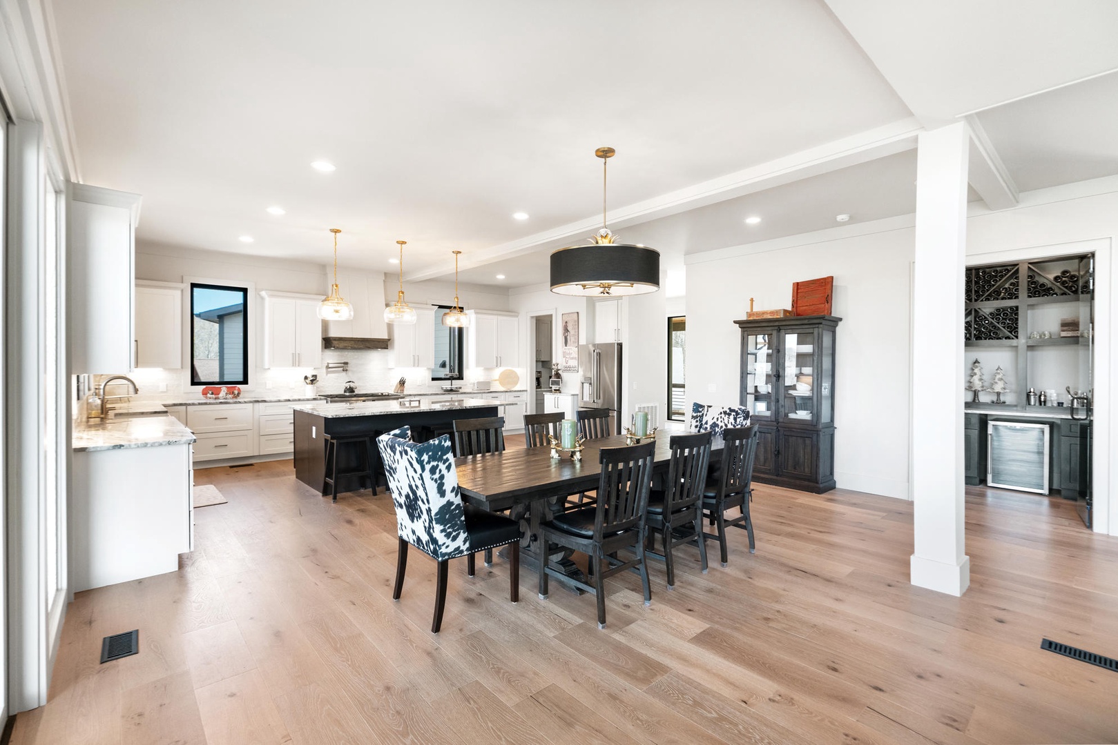Gather around this spacious dining table where your group can share memorable meals in the open-concept kitchen and dining area.