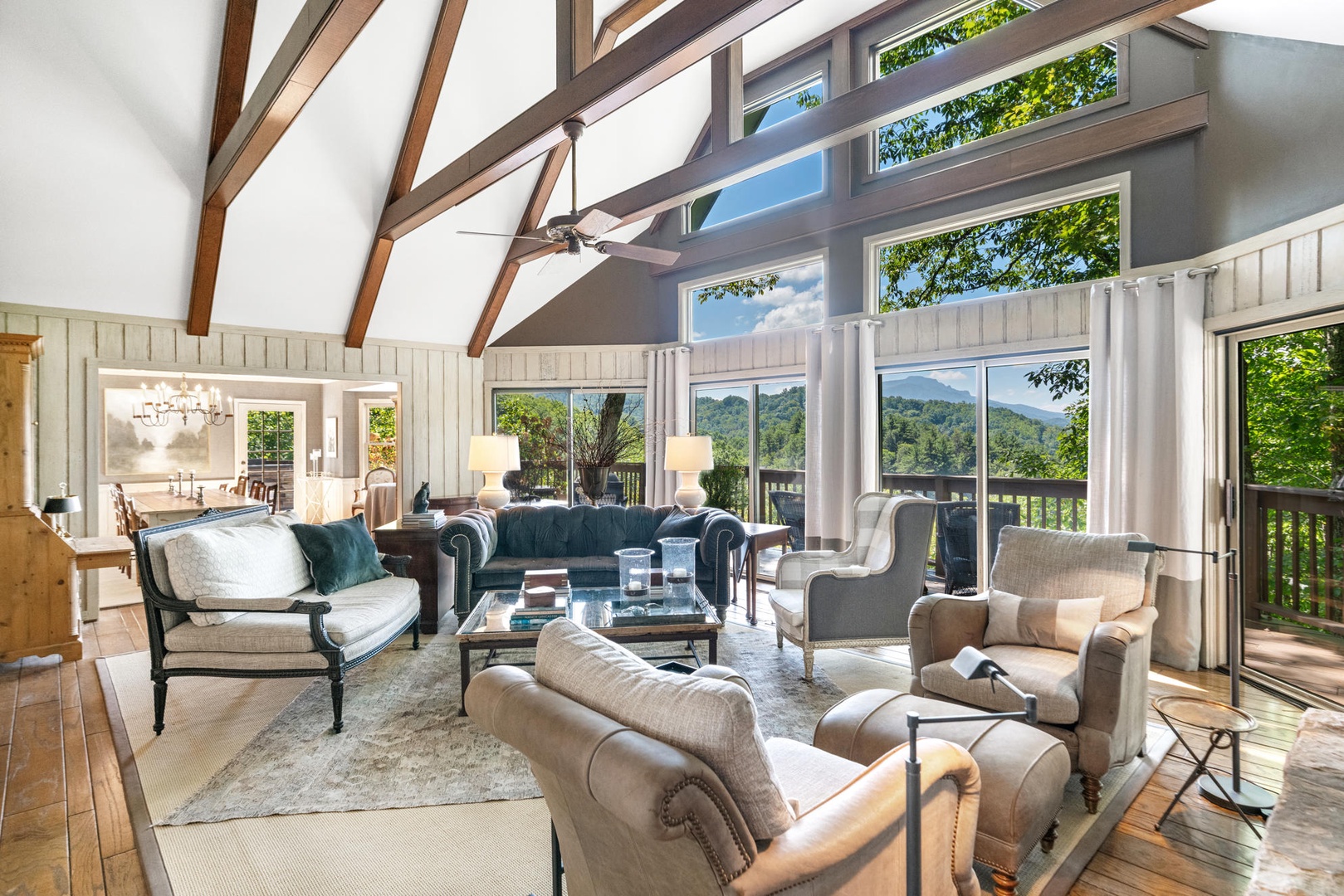 Living Room---Cathedral Ceilings, Large Windows with Natural Lighting, Cozy Furniture