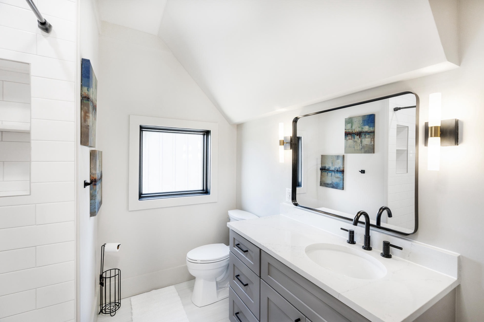 Unwind in your beautifully designed bathroom featuring a spacious vanity, modern fixtures, and natural lighting.