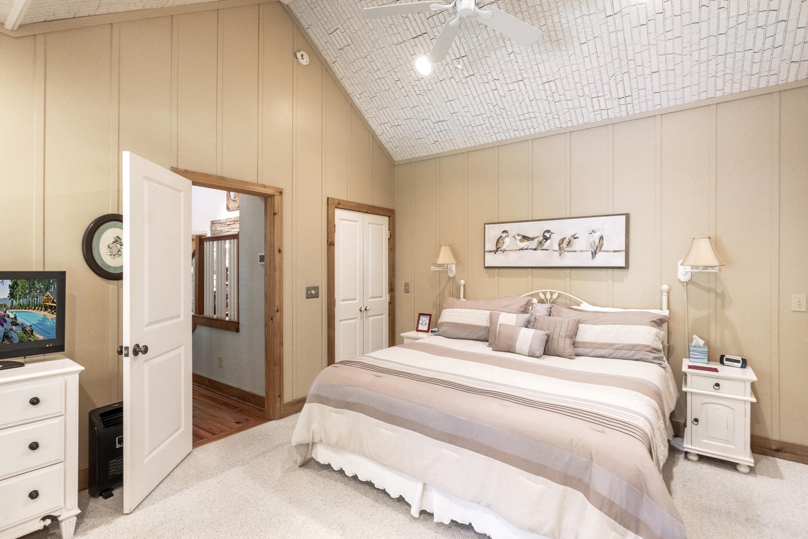 Primary Bedroom---King Size Bed, TV, Main Floor