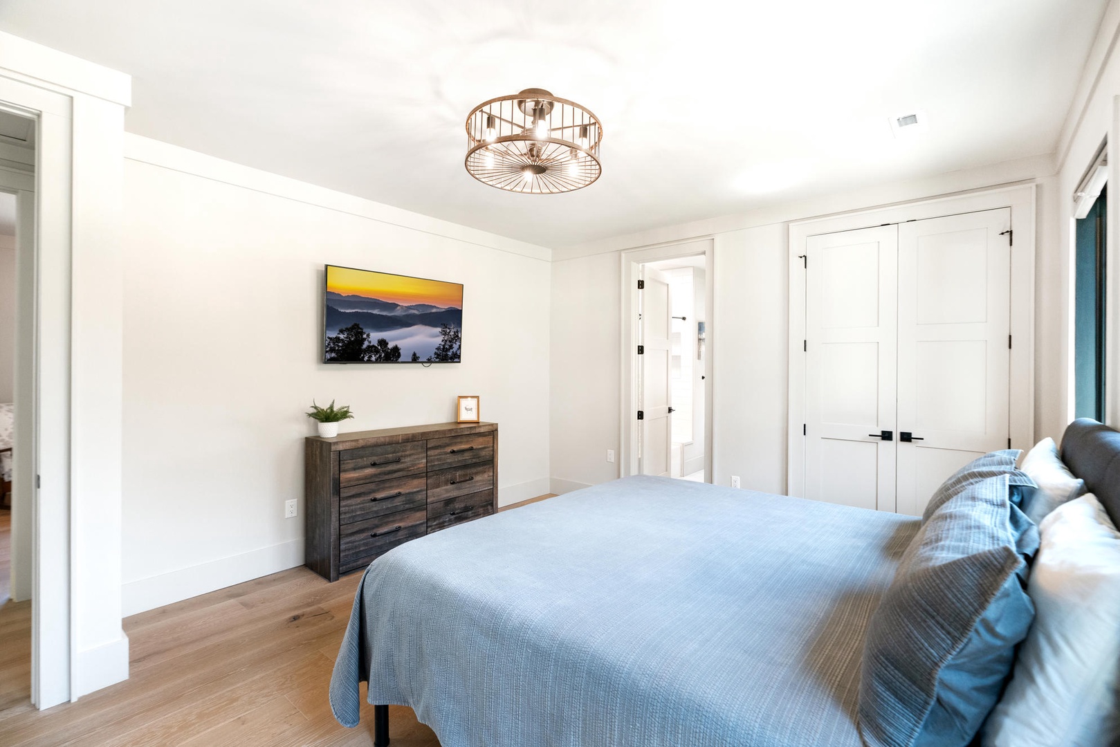 Drift into peaceful sleep in this beautifully appointed bedroom featuring warm wood floors and designer touches throughout. King size bed, upstairs.