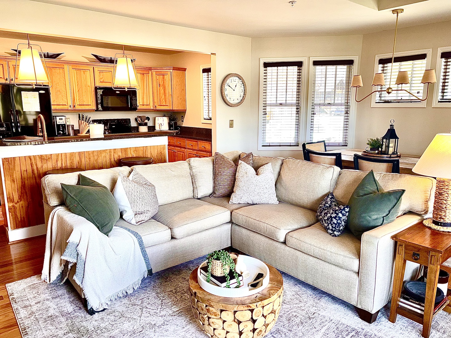 Warm, inviting living space with fireplace and mountain views just beyond.
