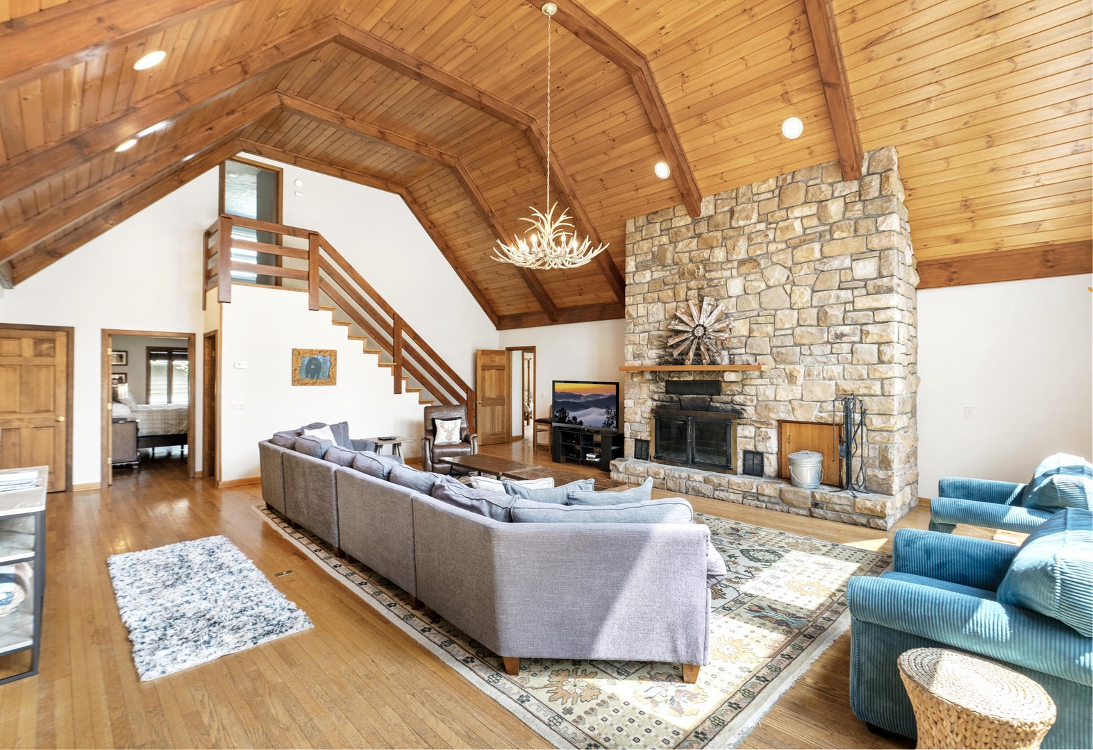 Living Room---Vaulted Ceilings, Natural Lighting, TV, Wood Burning Fireplace