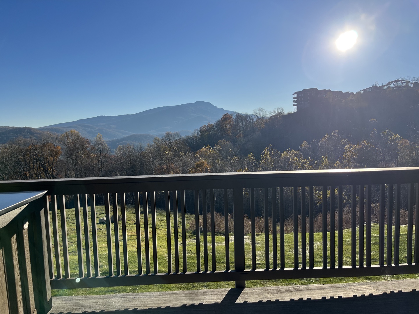 Breathtaking mountain views stretch before you from this peaceful balcony. Crisp morning light illuminates rolling peaks and autumn foliage, creating your perfect backdrop for coffee and reflection.