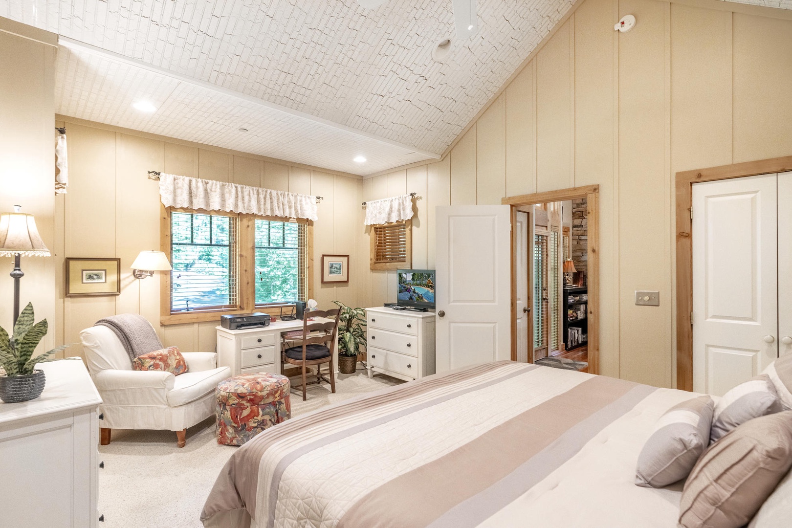 Primary Bedroom---King Size Bed, Television, Main Floor