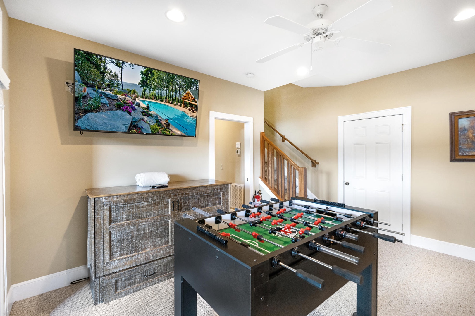 Rec Room---65" Roku wall mounted TV, Foosball Table