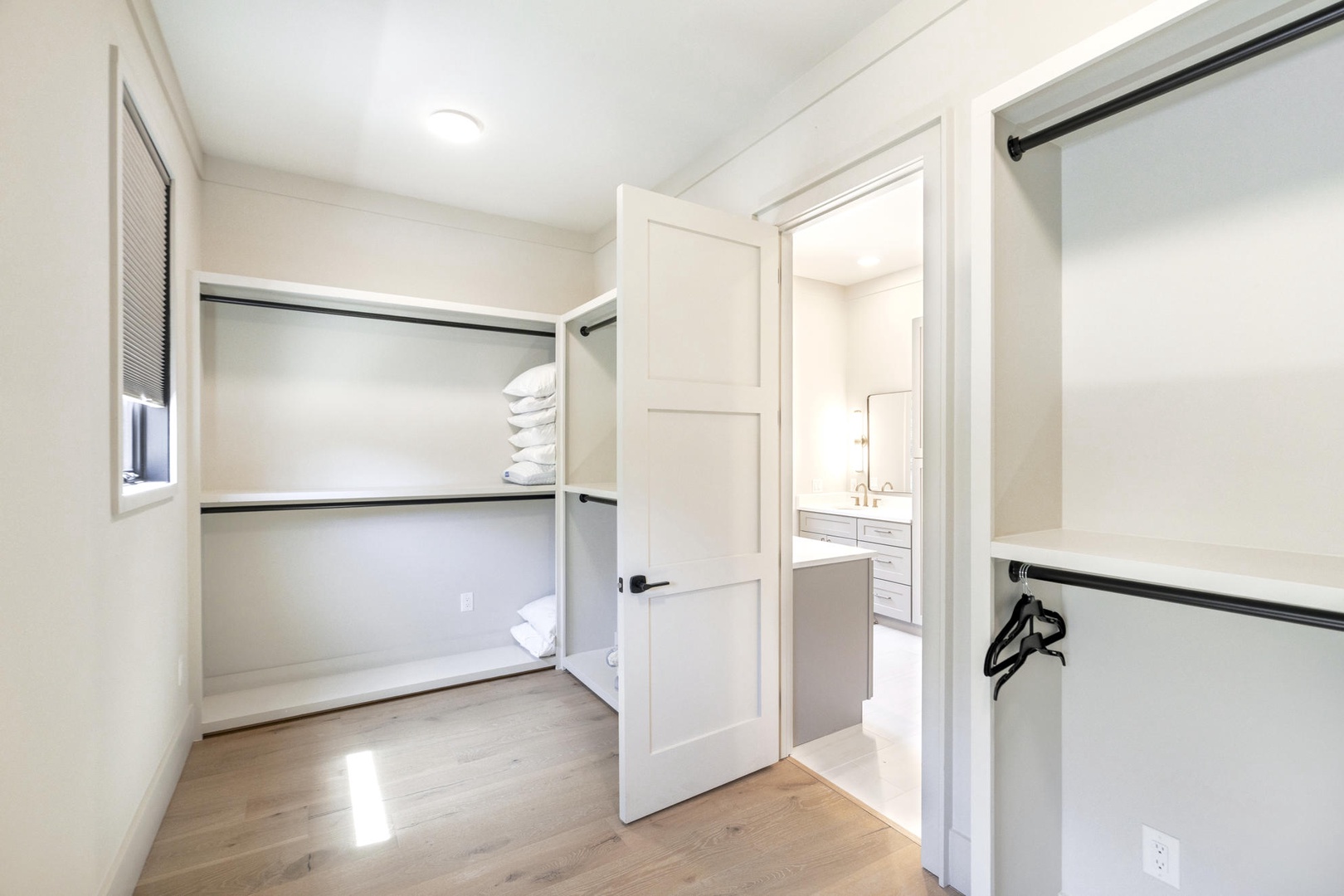 Your private walk-in closet offers ample hanging space and built-in shelving to keep your belongings perfectly organized throughout your stay.