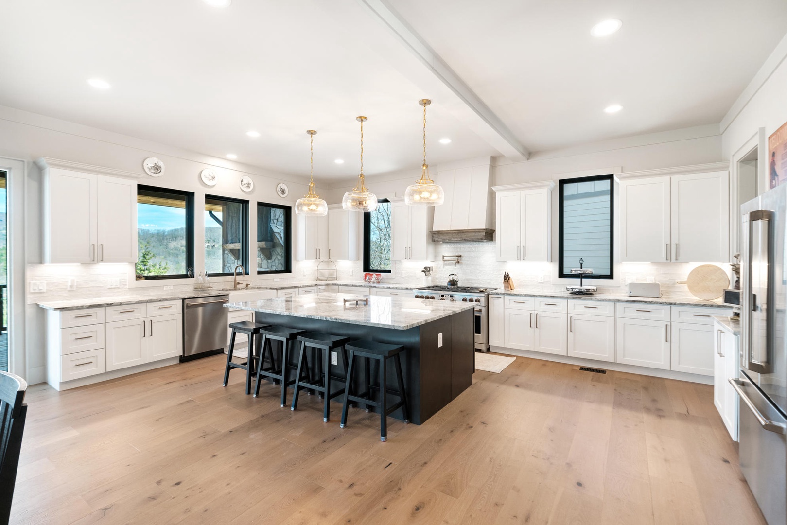 Your gourmet kitchen awaits with granite countertops, premium appliances, and a spacious island perfect for cooking memorable meals together.
