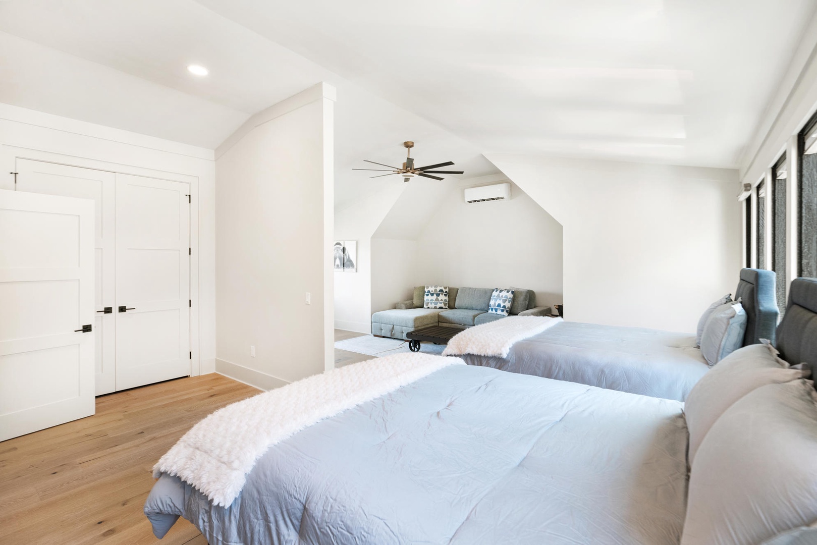 Unwind in your serene bedroom suite with queen beds and cozy sitting area - perfect for sharing stories after busy days.