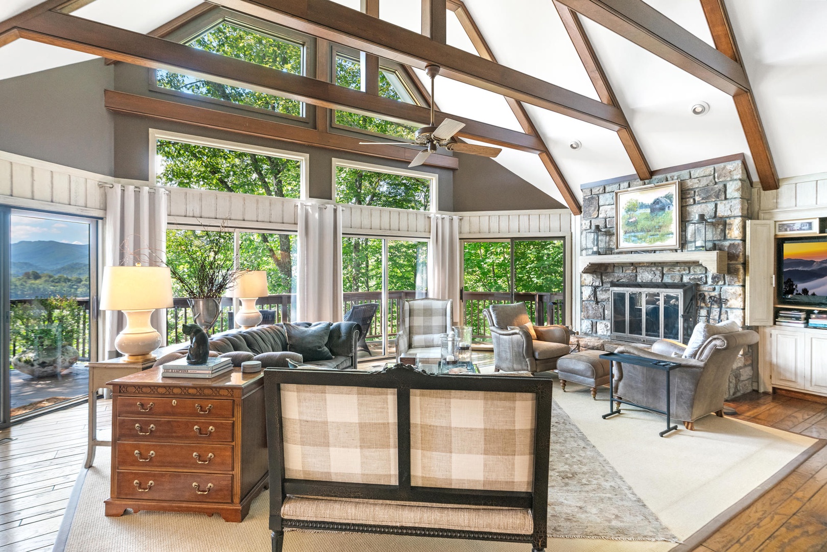 Living Room---Cathedral Ceilings, Large Windows with Natural Lighting, Cozy Furniture