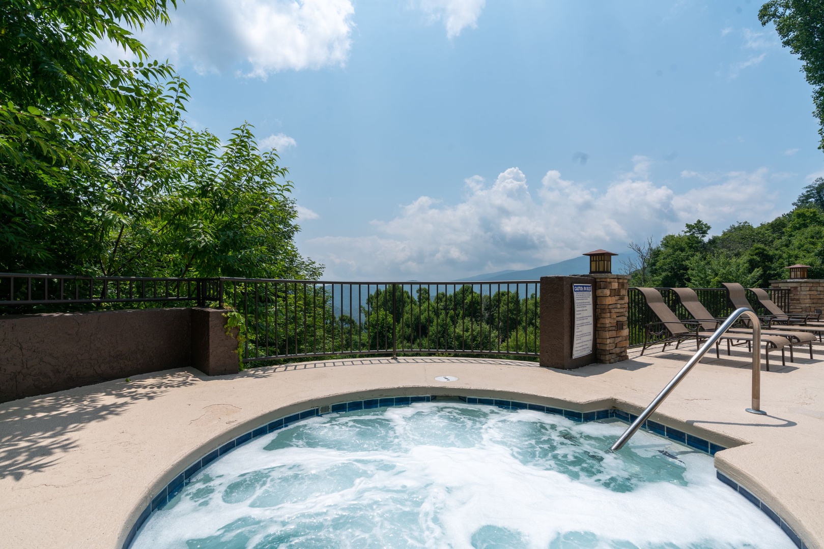 Soak in the bubbling hot tub while enjoying breathtaking mountain views and fresh air under open skies—the perfect spot to unwind after a day of adventure.