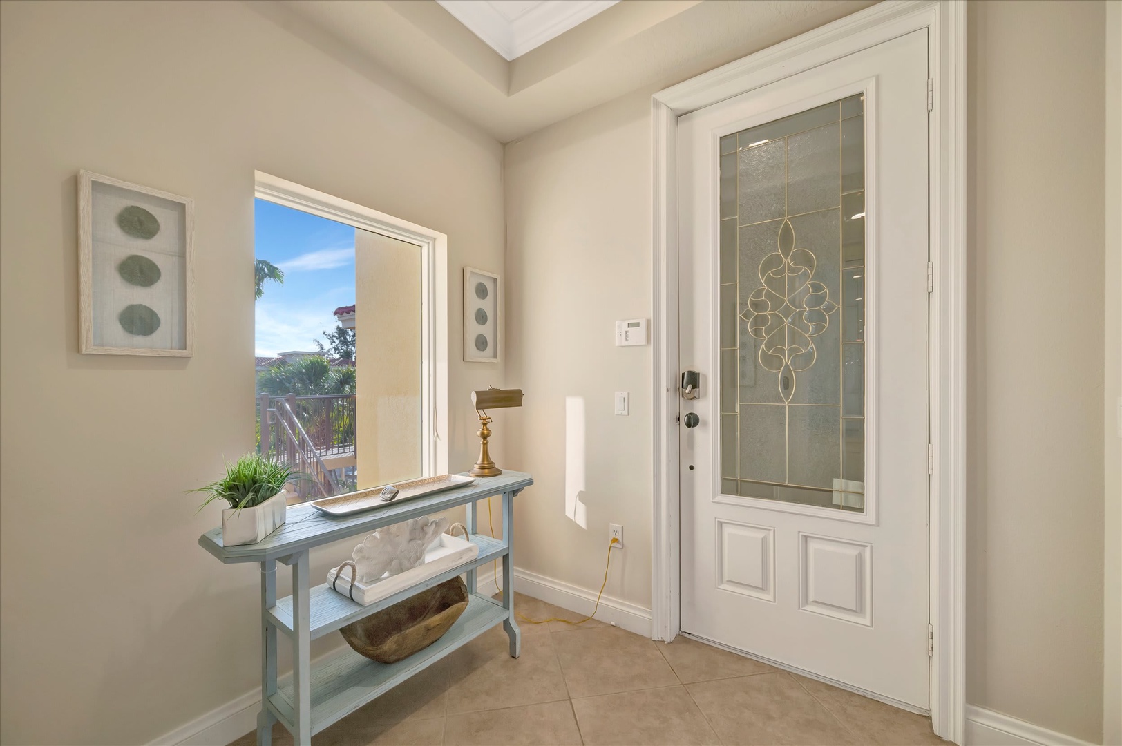 The entrance welcomes you with soft natural light, serene colors, and a thoughtfully styled console table—a perfect first impression for your stay.