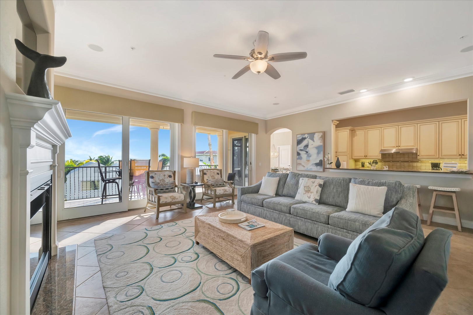 Settle into your bright, open living space where coastal breezes meet comfort. The open layout flows from plush seating to a private balcony, while warm beach-inspired tones invite you to relax after a day of exploring.