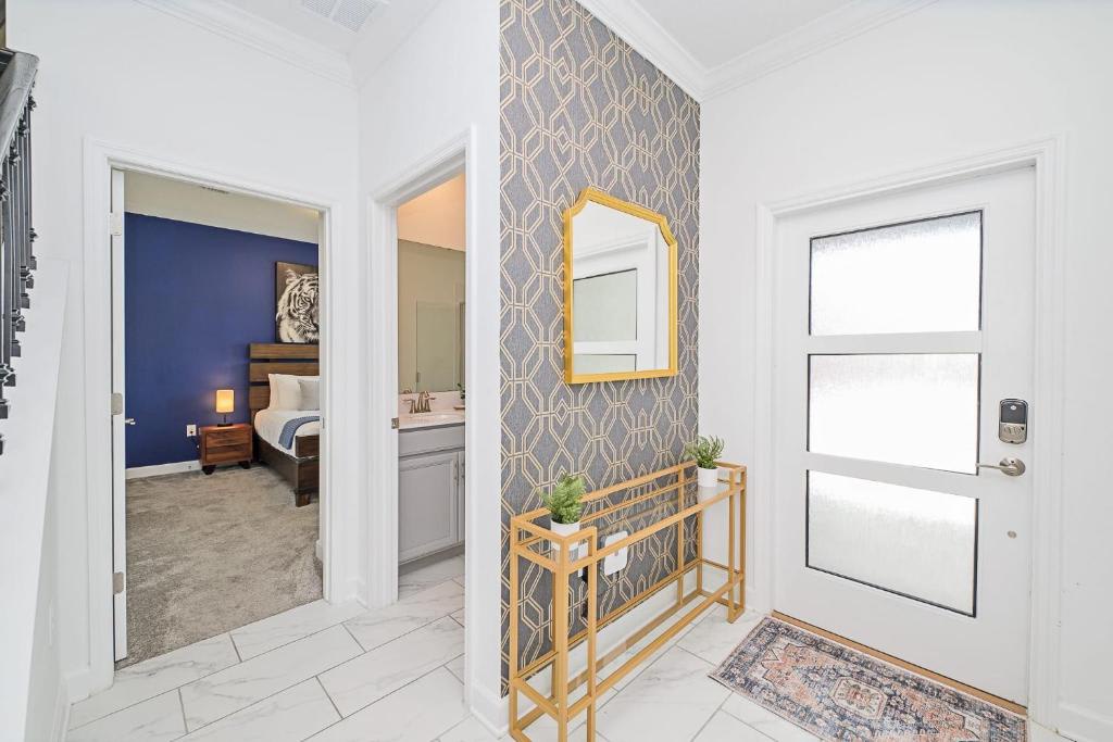 Step into your bright, welcoming entryway where stylish accents and thoughtful touches set the tone for your stay. From here, you're just steps away from your cozy bedroom retreat and modern bathroom.