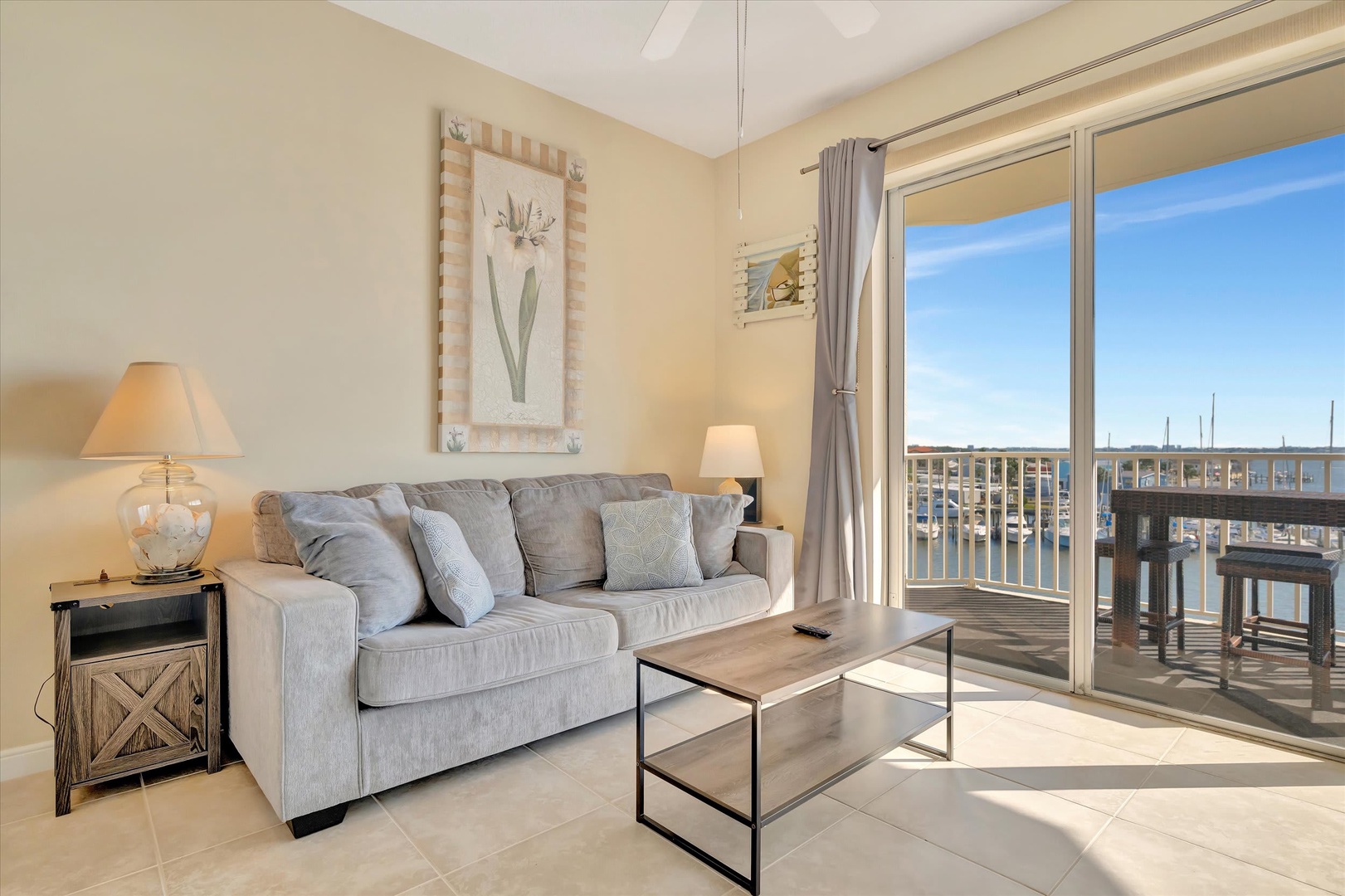 Sink into your cozy living area and let the soft coastal palette soothe your senses. Step outside to your private balcony and breathe in the fresh marina breeze.