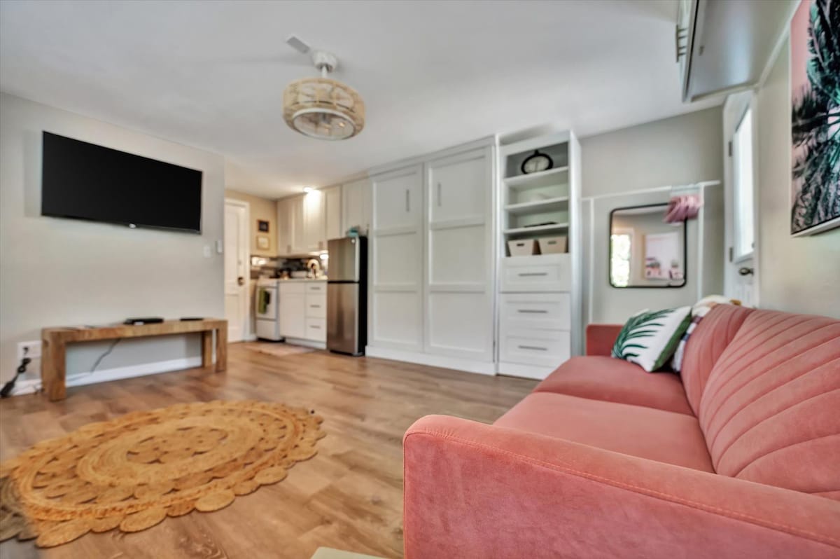 Sink into the velvet comfort of your living space, where coastal-chic style meets modern convenience. Your open-plan retreat flows seamlessly from lounge to kitchen, creating the perfect home base for your getaway.