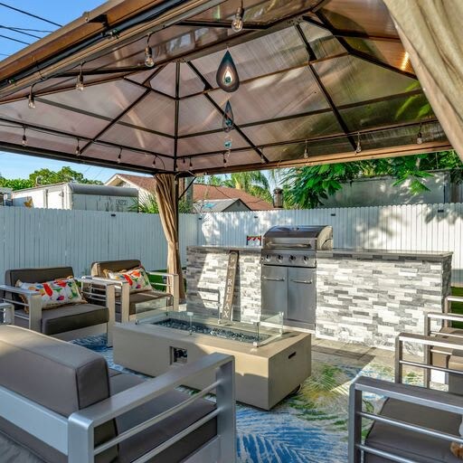 Your private outdoor oasis awaits with a stylish lounge area and built-in BBQ station, perfect for gathering with loved ones under the gazebo.