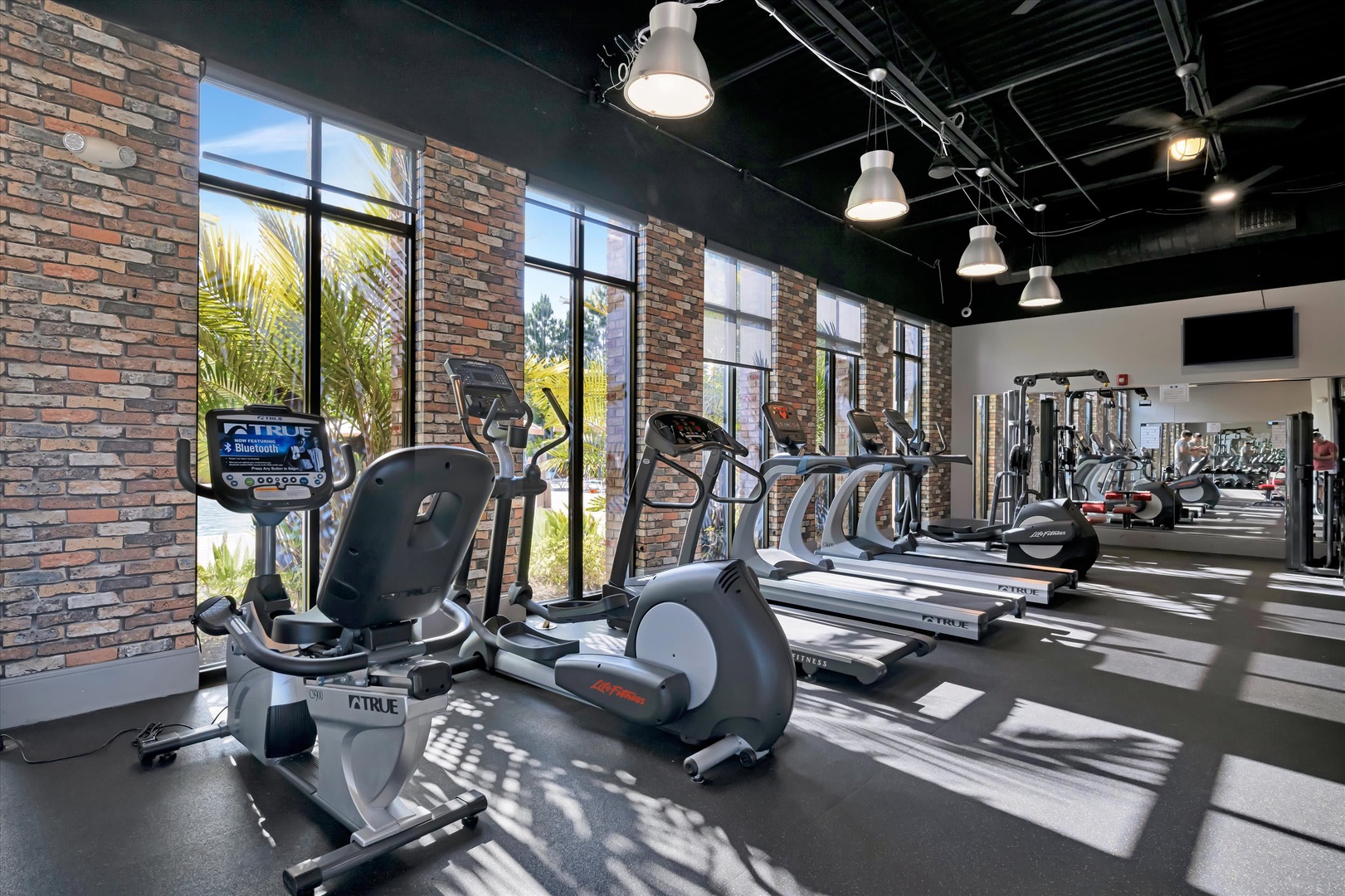 Stay active and energized in this modern fitness center, complete with cardio machines, free weights, and plenty of natural light to fuel your morning routine.