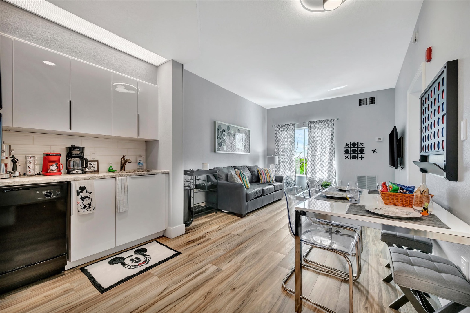 Step into your bright, open living space where modern comfort meets playful charm. Relax on the cozy sofa, whip up favorite meals in your fully-equipped kitchen, and enjoy stylish touches throughout—your home away from home awaits.