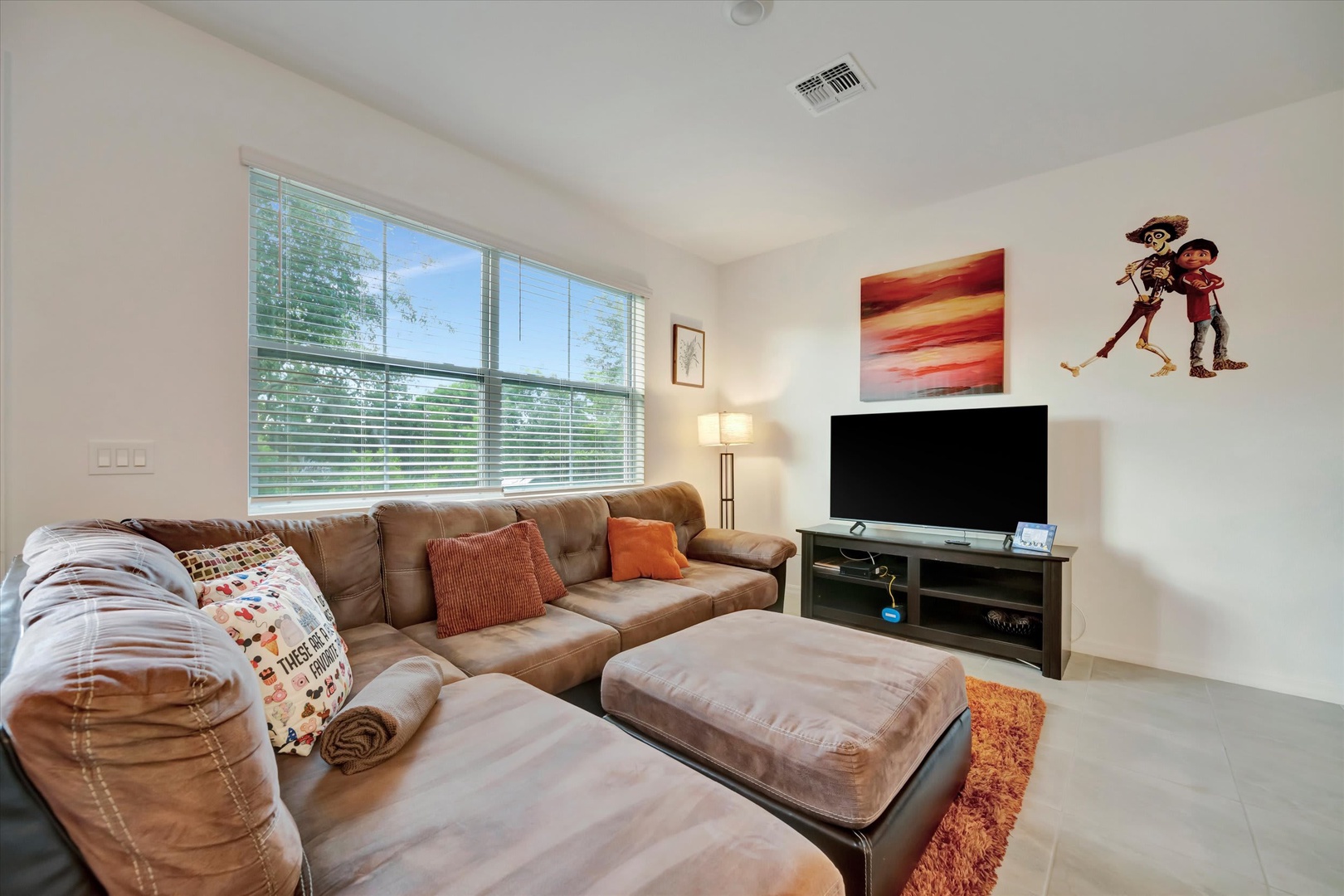 Sink into plush seating and unwind in your private living space, where natural light and cozy touches create the perfect spot for relaxing after a day of adventure.